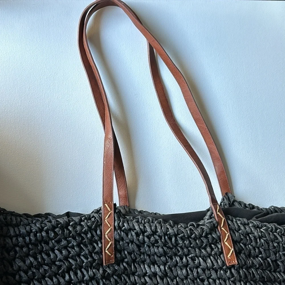 Kenneth Cole straw bag in back with tan straps